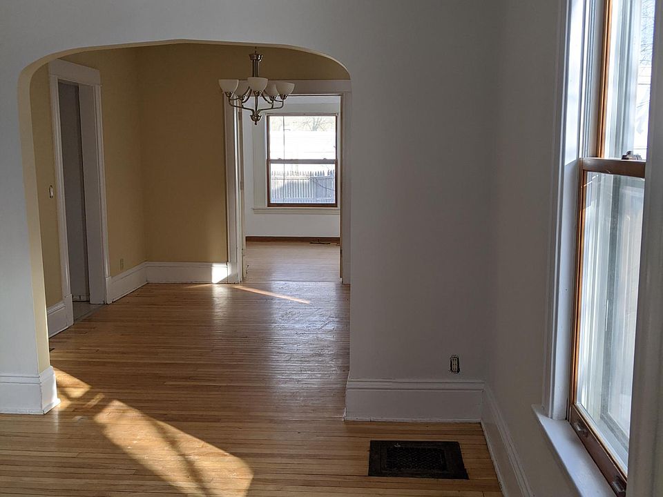 Main level hardwood floors: Living room with archway into dining room, then French doors into a bedroom which has typically been used as a sunroom.