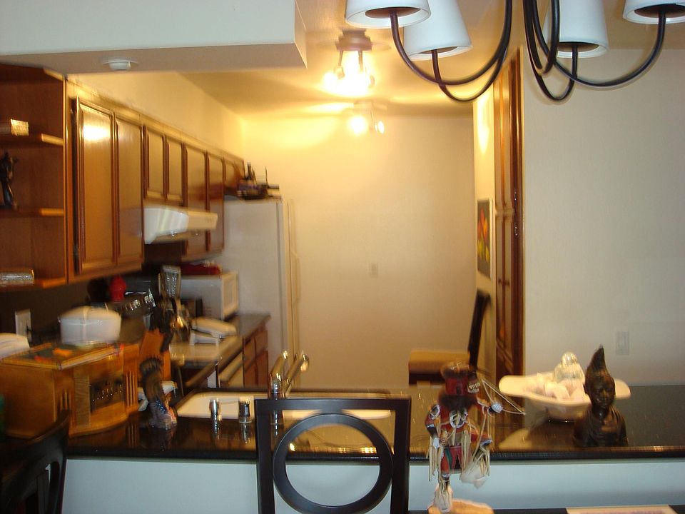 Open kitchen with wine frig and marble floors. Very pretty!