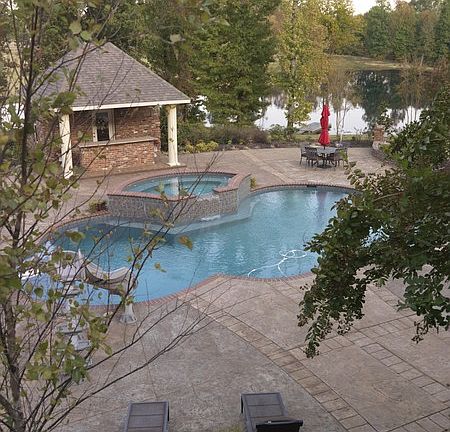 Upper Patio
						:
						View from upper patio of pool, pool house, and pond.