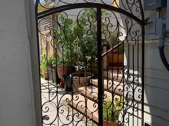 Courtyard gate to the Pool House from the front of the compound and Spa.