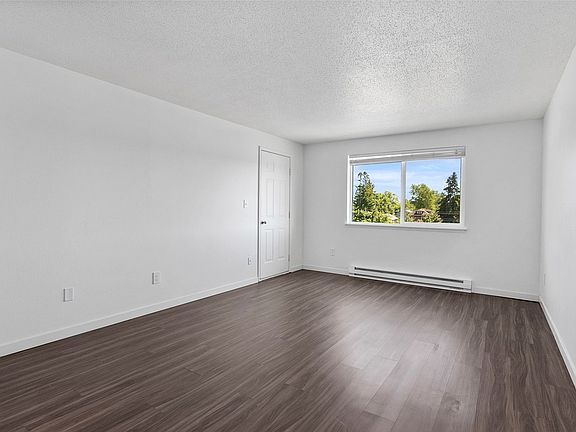 Living room with Great Wood Plank Floors, Faux Wood Cordless Blinds