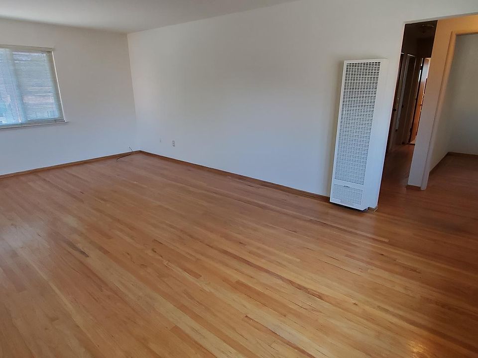 Living room looking into hallway and Dining room
