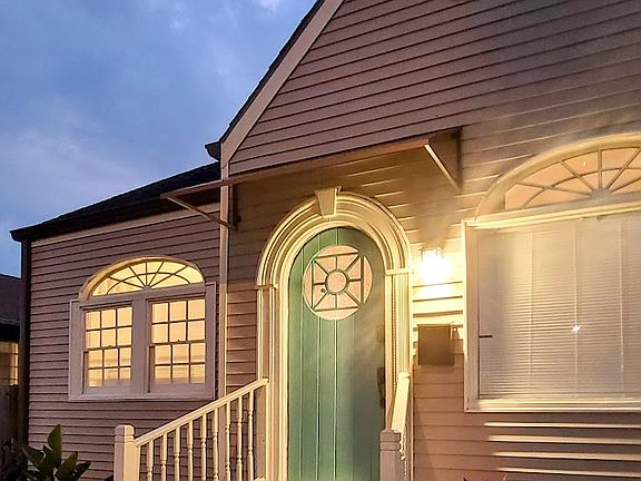 Front of home lit and landscaped.