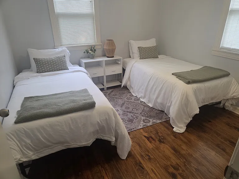 Bedroom 2 features two twin beds (38"x 78"). Phone charging ability on both sides of the bed. Bedroom 2 has a closet.