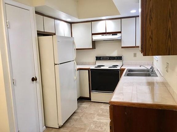 New tile countertops; Recessed LED overhead lighting.