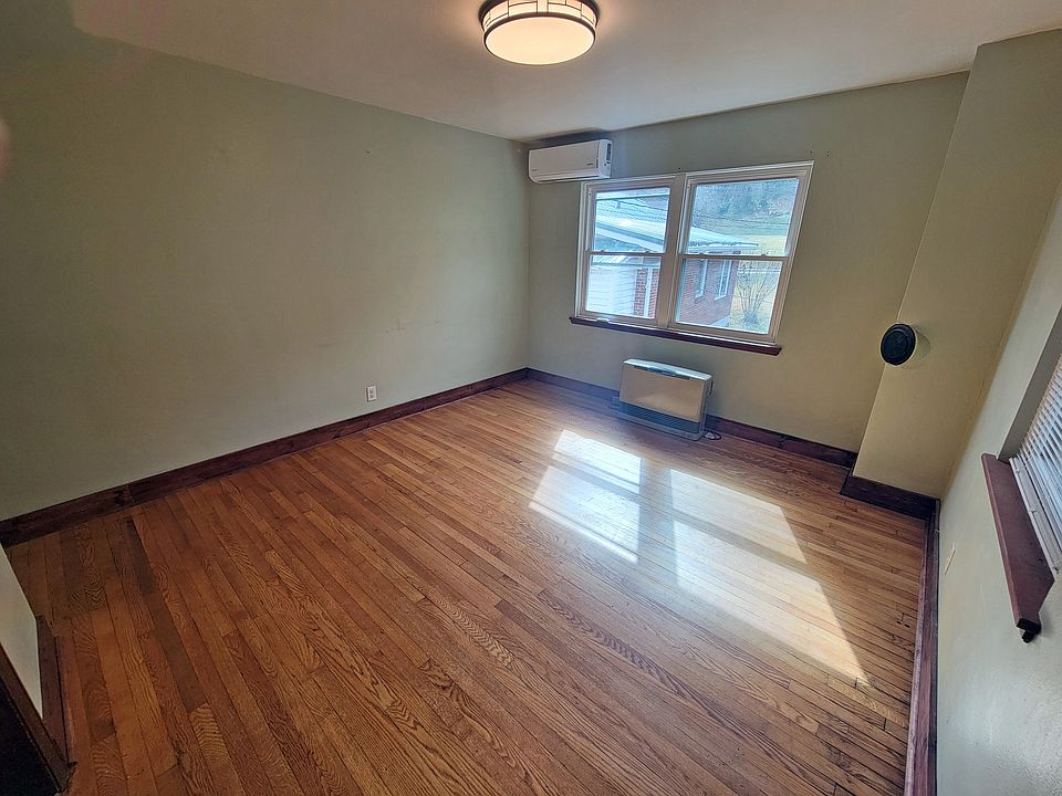 Living room with mini-split heat/air and supplemental propane monitor heater.