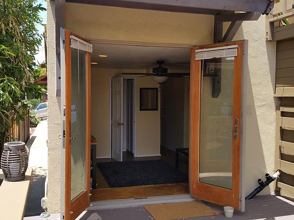 To the left of the photo is the long entryway from the street.