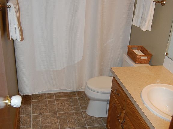 Bathrooms, each with updated flooring and lighting.