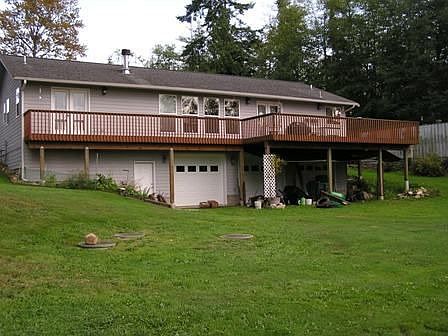back of Home showing Deck & Garage