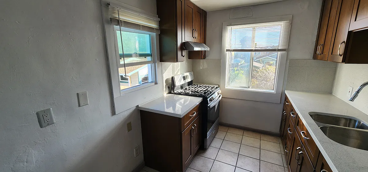 big kitchen with plenty of natural light . lots of cabinets for all your cooking essentials - 1474 7th St