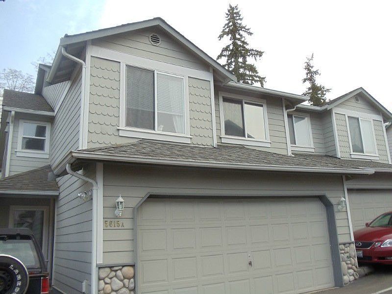 Exterior of home. 2 car garage plus extra parking space.