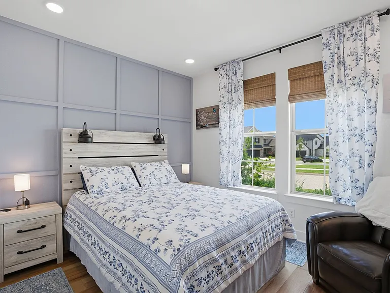 Note the charming board & batten accent wall in this front facing bedroom.