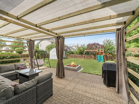 Enjoy new paver brick paver patio w/custom covered pergola!