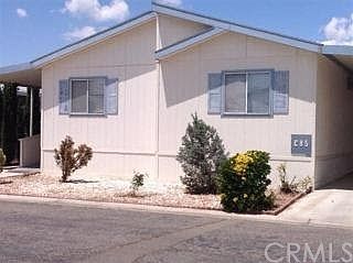 Double wide, 4 bedroom mobile-home with 3 car deep carport.