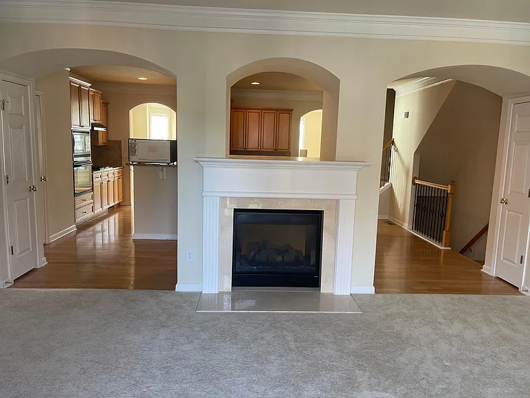 Double sided fireplace in family room and kitchen