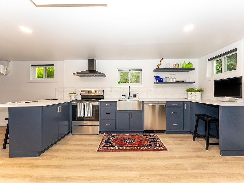 Hand-crafted, locally made custom cabinetry, solid quartz countertop, dishwasher, stove, and computer nook.