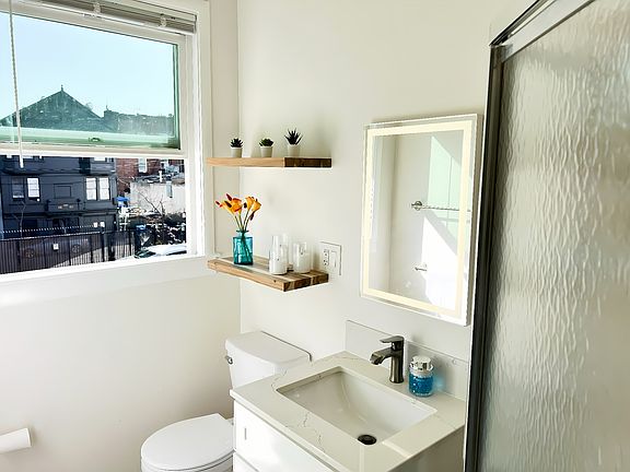 Bathroom - bright window + updated vanity and modern fixtures