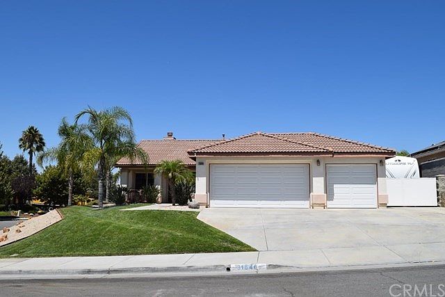 Stunning single level home with gated RV parking.