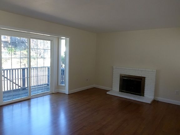 living room with slider and fireplace