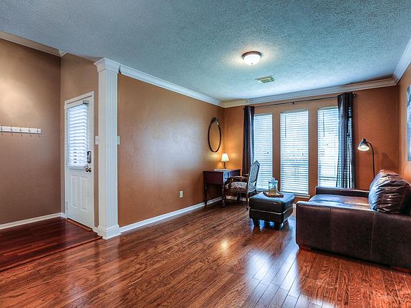 A formal living room sits at the front of the home.