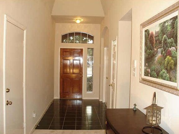 Entryway (tiled) with skylight