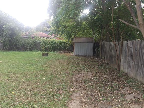 Big back yard with storage shed