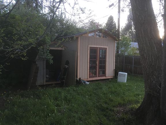 Two full-sized sheds available for storage.