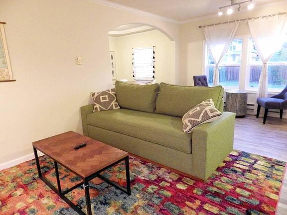 Queen sleeper sofa, smart t.v. and open concept area