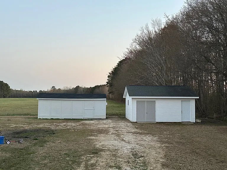 2 storage barns in the back yard. Both wired with receptacles and lighting