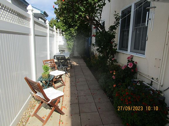 Rear Side with Weber Grill 
Picnic Table Available for Group Dining
Tall Vinyl Fence for Privacy