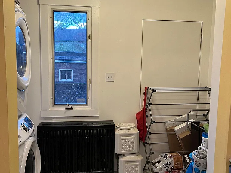 mud room (leads to back door on deck) with a half bath next to the washer dryer