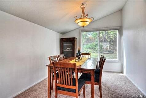 The formal dining room has a nice view of the park-like back yar