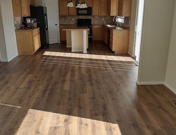 Open floor plan with a vaulted ceiling