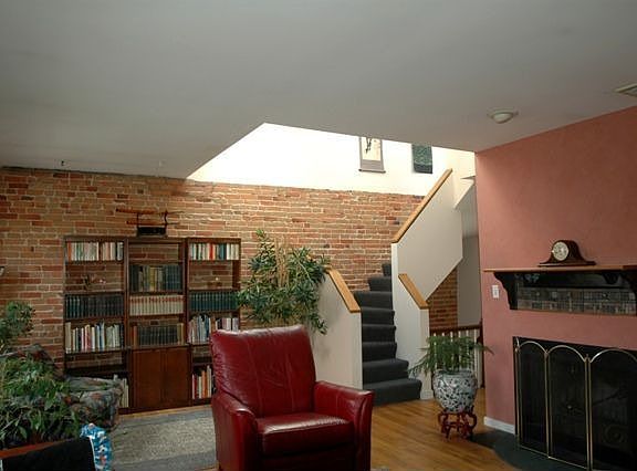 Fireplace & stairs to private rooof deck