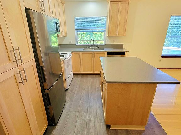 Kitchen with new cabinets, new flooring, quartz countertops