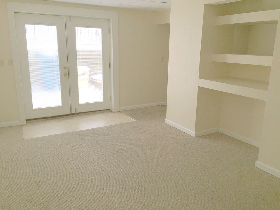 Expansive main living area features built in entertainment center.