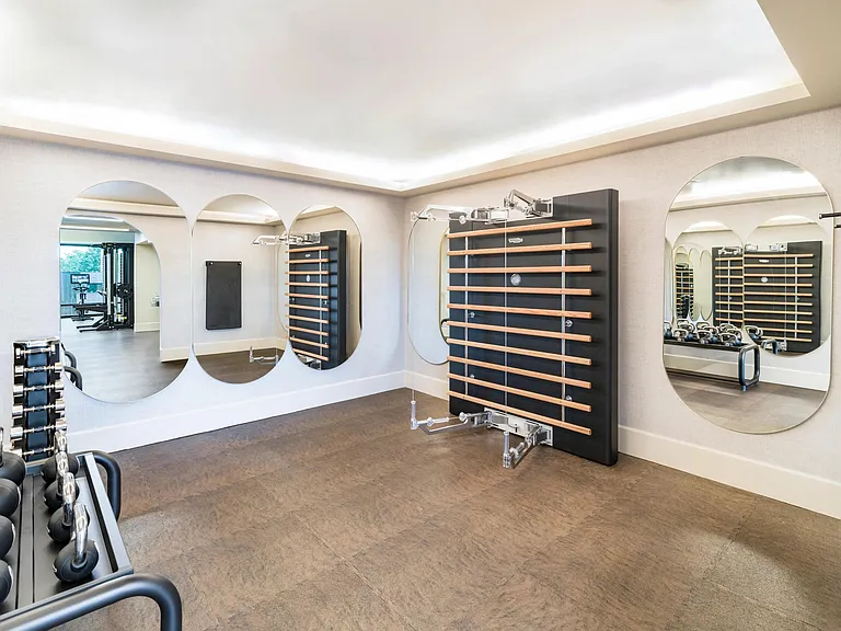 A purpose-built training room with a Pilates wall for strength training, flexibility, and mobility