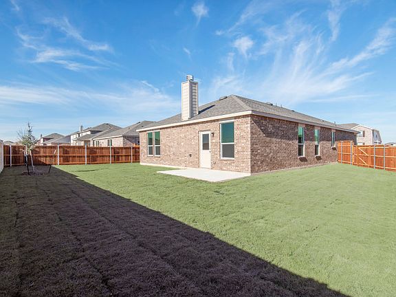 Spacious, fenced-in backyard.