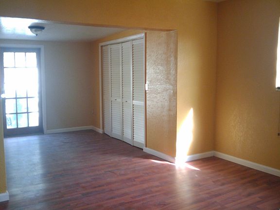 Master Bedroom with sitting area and french door to pool