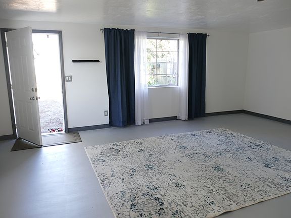 The entrance to Studio A. It is unfurnished . There is a new floor carpet. The floor has been newly painted and waxed with a fine finish. The entire studio has been re-painted top to bottom.
