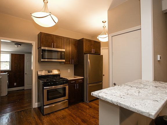 Open concept with bar seating and granite counters.