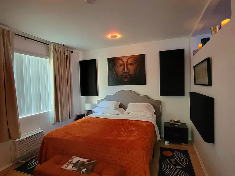 relaxing king size bed with acoustic wall panels