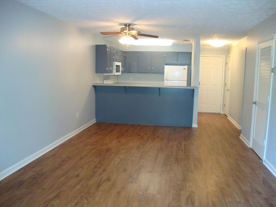The kitchen opens on to the dining/room area with a bar that, with the addition of some stools, makes a great place for a meal or snack!