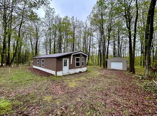 8448 Heatherton Cir, Mancelona, MI 49659