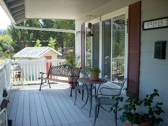 front porch + pump house in view