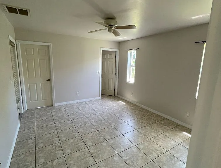 Master bedroom with walk-in closet and direct entrance to bathroom