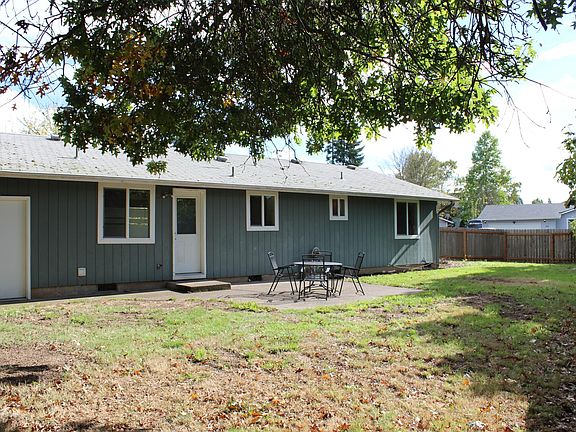 Backyard is fenced and faces West for evening sunshine.