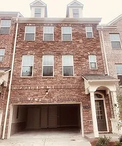Front of the house with two car garage .