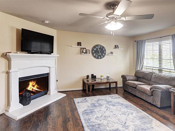 Living room with wood burning fireplace