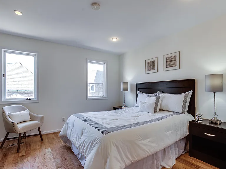 Hardwood floors and windows over the quiet courtyard.
